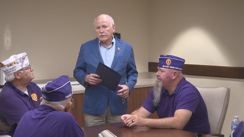 Lawton Mayor Stan Booker delivers a Purple Heart Day proclamation to the Military Order of the...